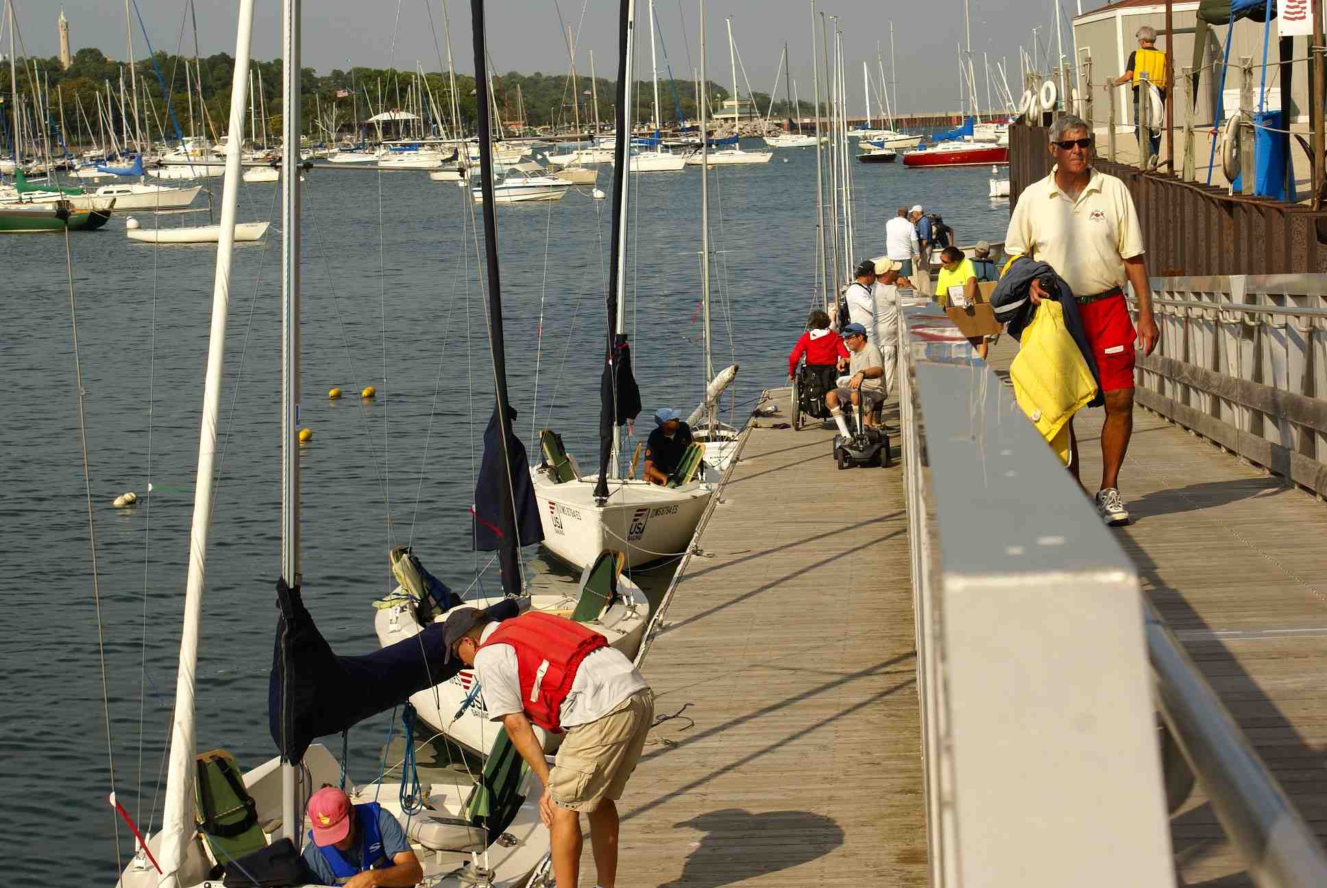 MCSC Volunteers and sailors on dock and ramp