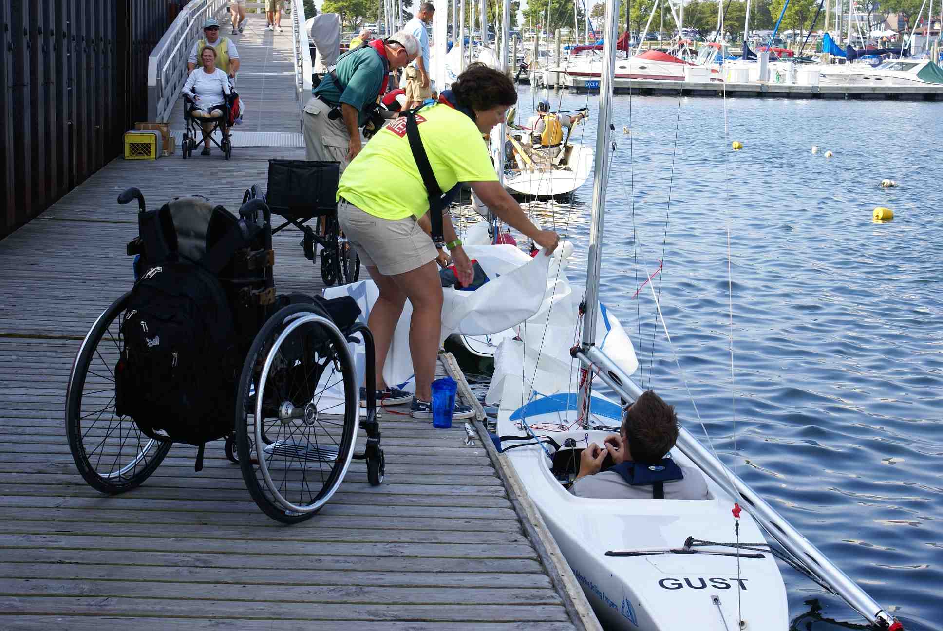 MCSC Volunteers and sailors on dock and ramp