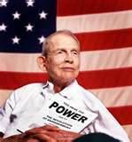 Mr. Justin Dart, Jr. Justin Dart with POWER pamphlet, American Flag in background