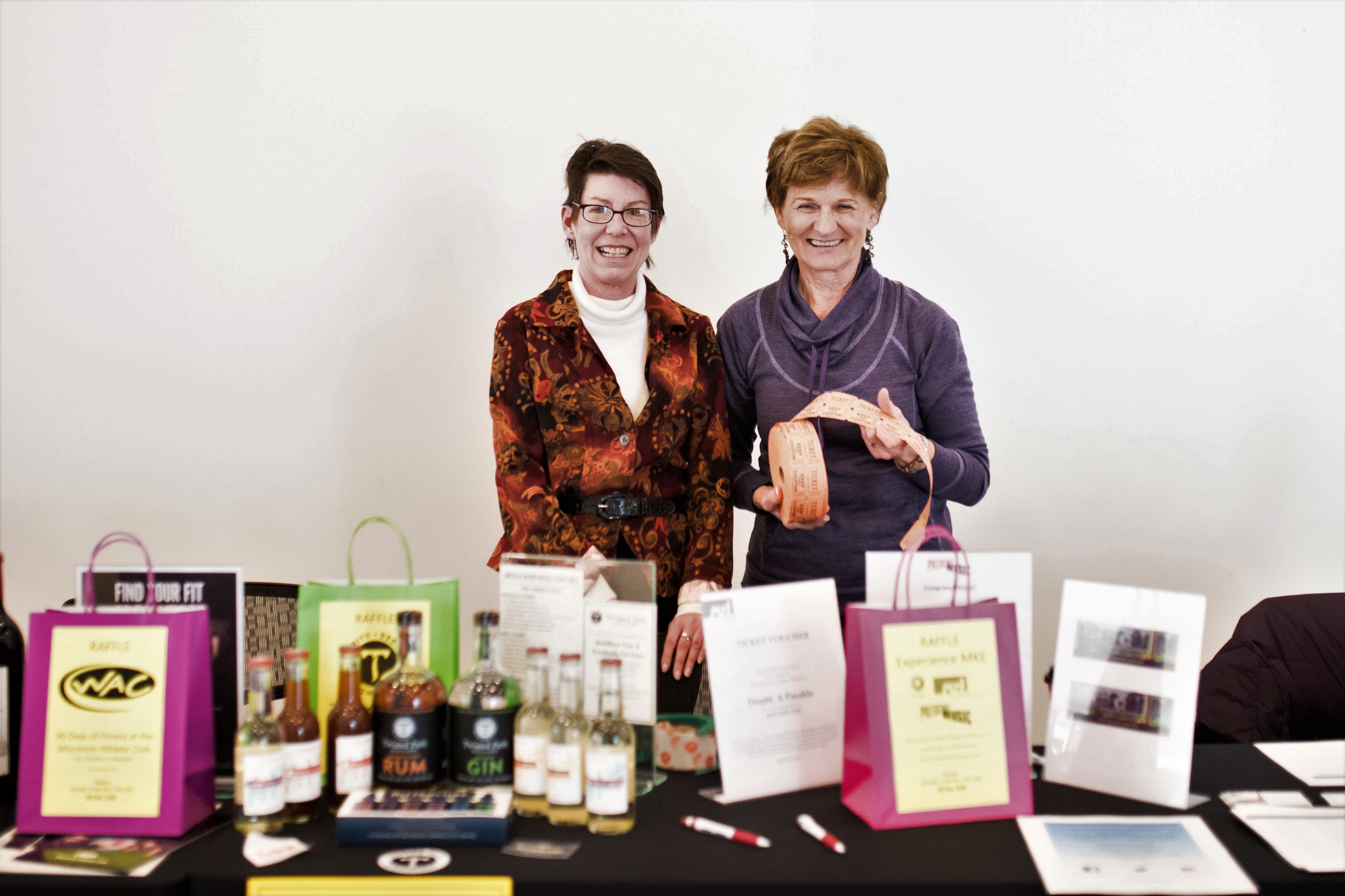 Raffle and Silent Auction NHU staff displaying event table at our event